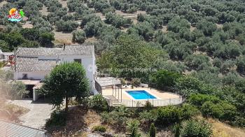 Iznajar, spacious character 4 bedroom, 2 bathroom country home with swimming pool, stunning panoramic views and wonderful outside space with large garden with various fruit trees.